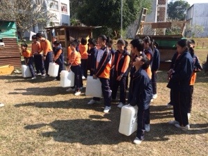 the kids feel the heaviness of typical amount of water that must be carried