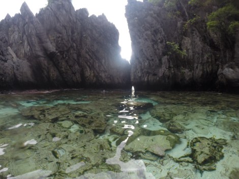 view of the crevice from the beach...the small opening we swam through to get here. it looks deceivingly peaceful from this viewpoint