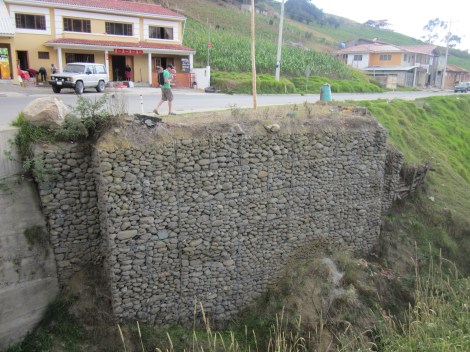 a gabion retaining wall, we just put one of this in at our house, now I see them everywhere
